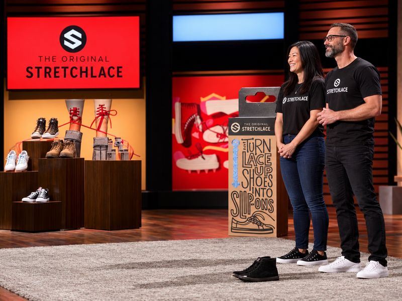 David and his wife on the Shark Tank set, presenting The Original Stretchlace